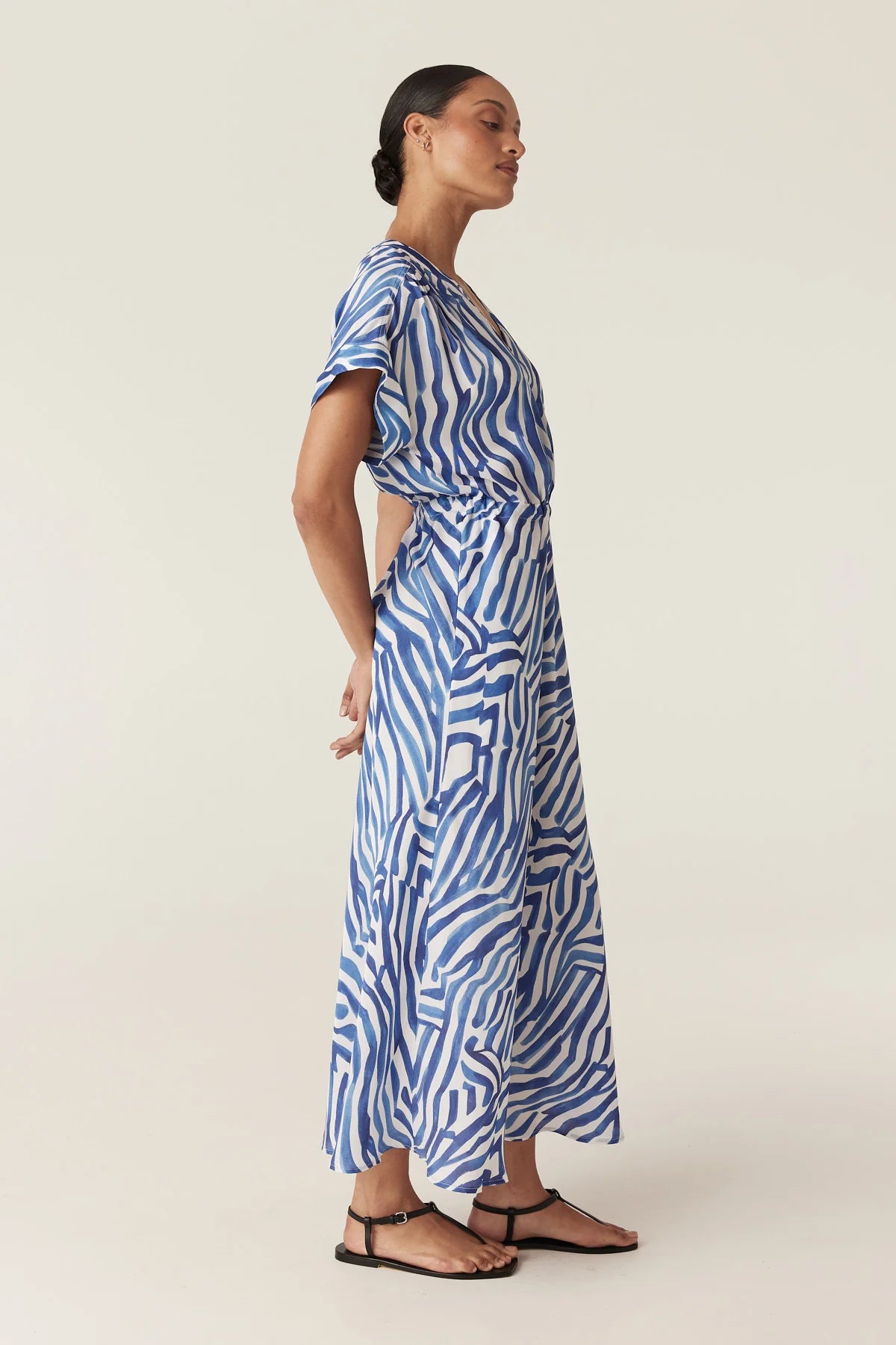 Cable Melbourne Sea Breeze Midi Dress in Blue Wave Print, worn - side showing the bias-cut skirt