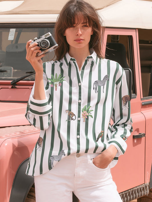 Vilagallo Isa Stripes Print Shirt in green worn by model with camera, safari animal print
